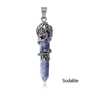 Macro view of blue sodalite hexagonal pillar pendant with antique silver floral wrap