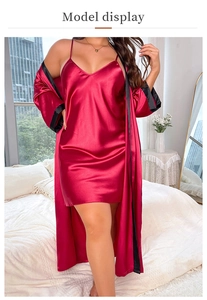 Detail of red satin pajamas set featuring a V-neck chemise and long-sleeved silk robe