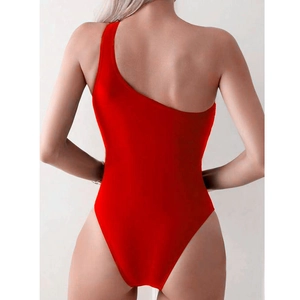 Elegant red one-shoulder monokini featuring an open back and high-cut leg for beachwear