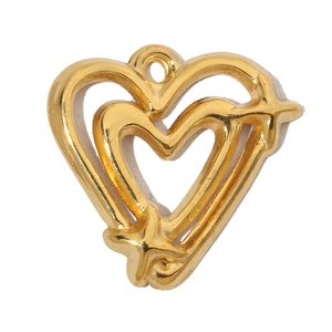 Macro shot of gold hollow heart pendant with star detail for DIY necklace making