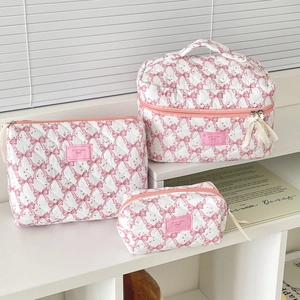 Three-piece quilted makeup bag set with pink bows and Sweet Dream label