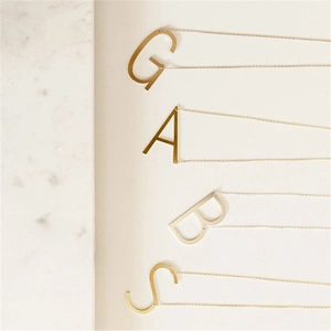 Minimalist stainless steel A G B S initial necklaces in gold and silver finish