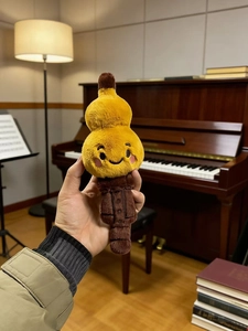 Close-up of a creative gourd-shaped plush toy with vivid facial features in a home setting