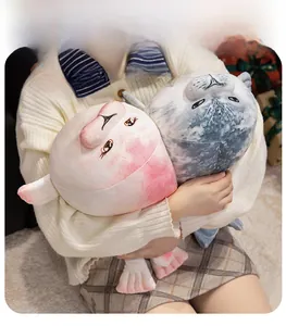 Soft plush seal and blobfish toy set held by a person to show cozy size and texture
