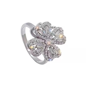 Rotating four-leaf clover ring in silver finish with shimmering clear cubic zirconia