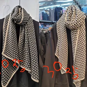 Classic black and white houndstooth scarf with elegant ribbed edges in cotton linen fabric