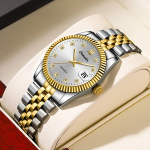 Detailed macro of a two-tone quartz watch with diamond markers on beige leather pillow