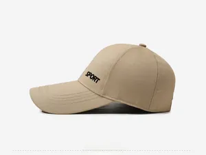 Close-up of khaki canvas baseball cap featuring bold black SPORT embroidery on the side