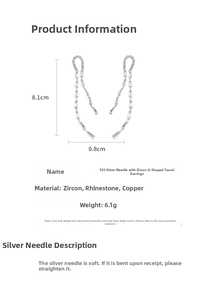 Detail view of U-shaped tassel earrings with zirconia, 8.1cm length on white background