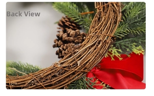 Close-up of Christmas wreath back with brown rattan base and natural pine cones