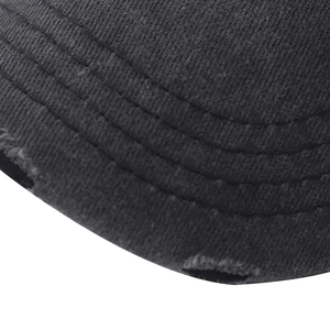 Close-up of black washed cotton baseball cap with distressed brim and stitching details