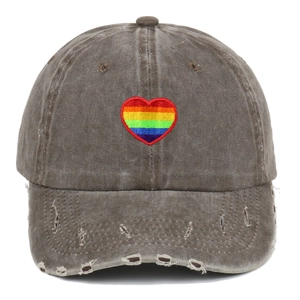 Vintage brown washed cotton baseball cap with rainbow heart embroidery and distressed brim