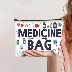Close-up of canvas medicine bag featuring medical illustrations and zipper closure