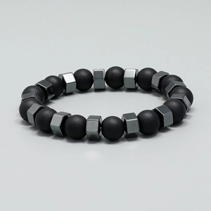Unisex beaded bracelet with matte black round beads and dark grey hexagonal metal spacers