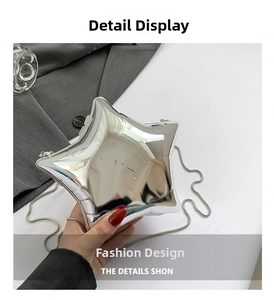 Detail shot of the glossy silver star-shaped clutch bag with a slim metallic chain strap