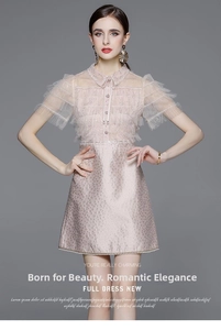 Detail of pink dress featuring a sheer high collar with bow tie and mesh ruffle sleeves