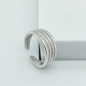 Detailed macro view of S925 sterling silver four-line toe ring with polished finish