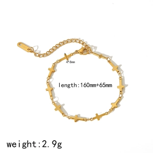 Detail of 18k gold plated stainless steel bracelet with 4.8mm cross charms and extension chain