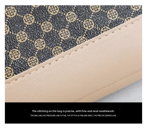 Close-up of precision stitching on brown floral shell bag with beige leather trim