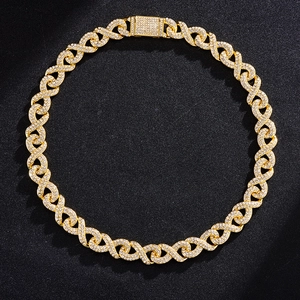 Detail of gold Cuban link chain necklace with micro-paved diamonds and square clasp