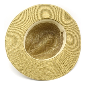 Close-up of golden straw hat interior with adjustable sweatband and fine weaving
