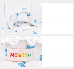 Detail of padded handle and colorful woven label on quilted bow makeup bag