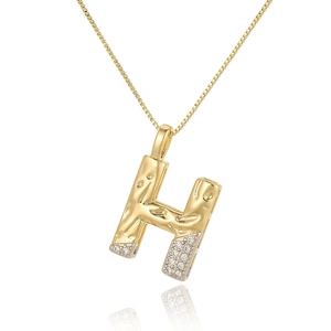 Macro shot of two-tone H-letter pendant necklace with white zircon and box chain