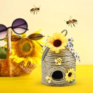 Detail of jute rope woven honeycomb hanging ornament with sunflowers and bees