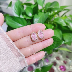 Handheld vintage oval pink crystal stud earrings with gold scalloped metal border