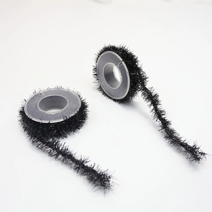 Close-up of two rolls of black tinsel garland with metallic wire for DIY Halloween decor