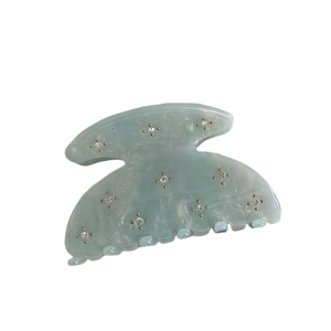 Light blue acetate hair claw clip with rhinestones and marble texture for women