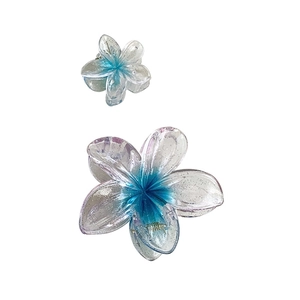 Two-piece gradient blue plumeria hair claw clips with silver glitter resin finish