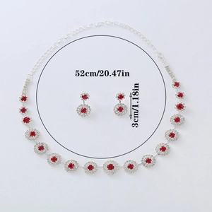 Silver jewelry set with red round rhinestones featuring a necklace and drop earrings