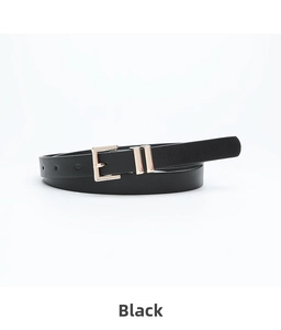 Detail view of a black leather belt with a polished gold pin buckle and dual metal loops
