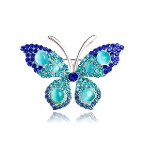 Exquisite silver vintage butterfly brooch with blue rhinestones and cyan cat eye stones