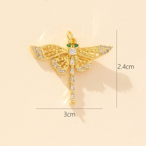Detail view of a 3x2.4cm dragonfly pendant with green stones and zircon wings