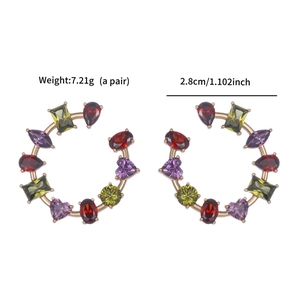 Detailed view of C-shaped earrings with colorful zircons, size 2.8cm and 7.21g weight