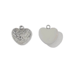 Detailed view of silver heart charms with embossed texture and polished smooth back