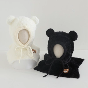 Detail view of plush bear ear winter hats with premium faux fur and bear embroidery
