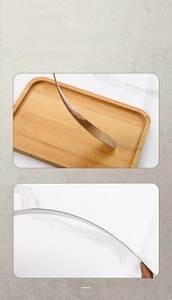 Macro shot of flexible stainless steel cake spatula blade showing high elasticity and wood handle