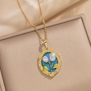 Baroque pearl flower pendant necklace with blue enamel and gold chain on silk