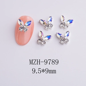 Macro shot of 3D butterfly nail charms with silver metal and AB color rhinestones