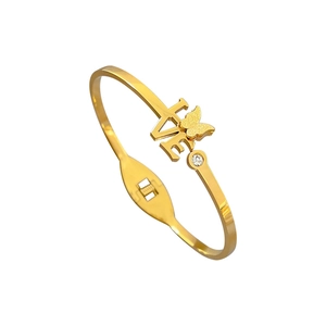Gold butterfly LOVE bangle in titanium steel with a matte finish and zircon stone