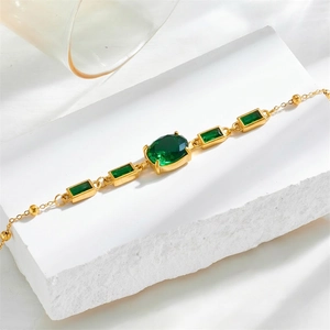 Retro 18K gold plated titanium steel bracelet featuring emerald green gemstones