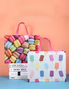 Detail of waterproof non-woven tote bags with colorful macaron and ice cream prints