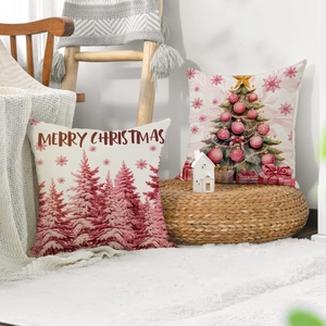 Detail of pink Christmas linen pillow covers with festive tree and letter prints