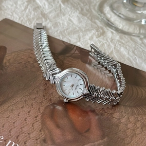 Elegant ladies quartz watch with silver fishbone strap and white mother of pearl dial