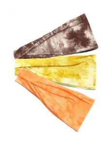 Detailed view of three-piece set tie-dye elastic yoga headbands in coffee, yellow and orange