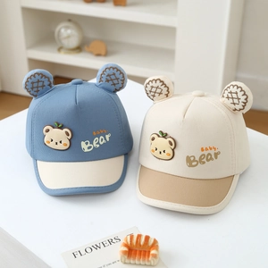 Detail of baby bear baseball caps with cute ears and contrasting color-block design
