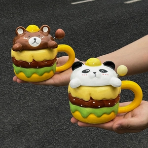 Cute cartoon burger ceramic mugs with bear and panda lids and spoons in hand